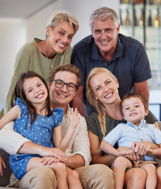 Family smiling while discussing the Canadian Dental Care Plan