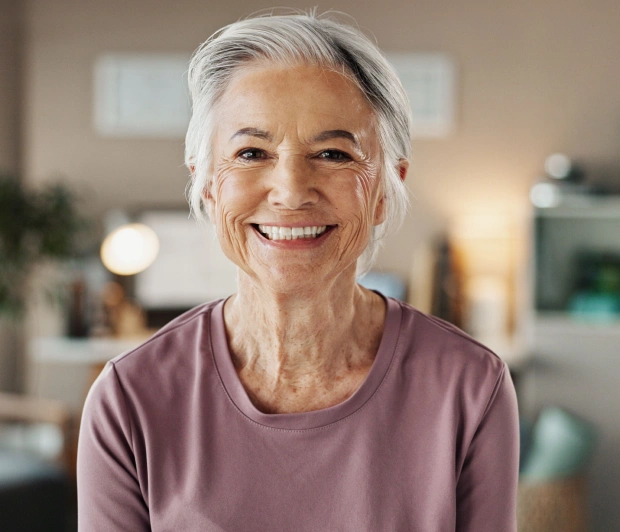 Smiling patient after dental implant treatment