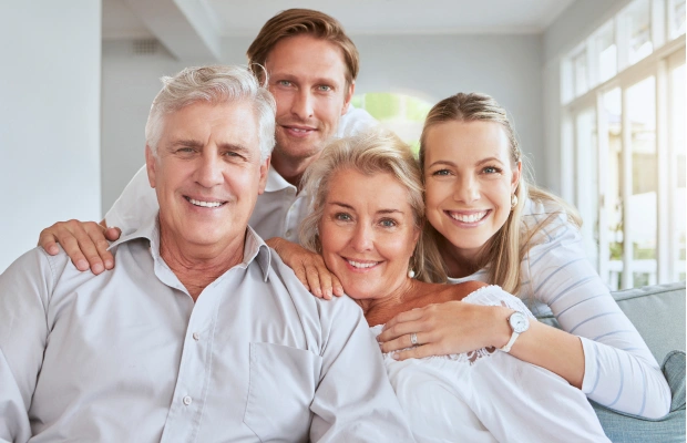 Friendly dental team welcoming a family