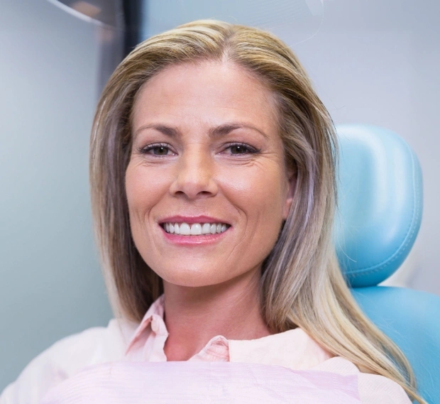 Dentist smiling during a preventive dental appointment