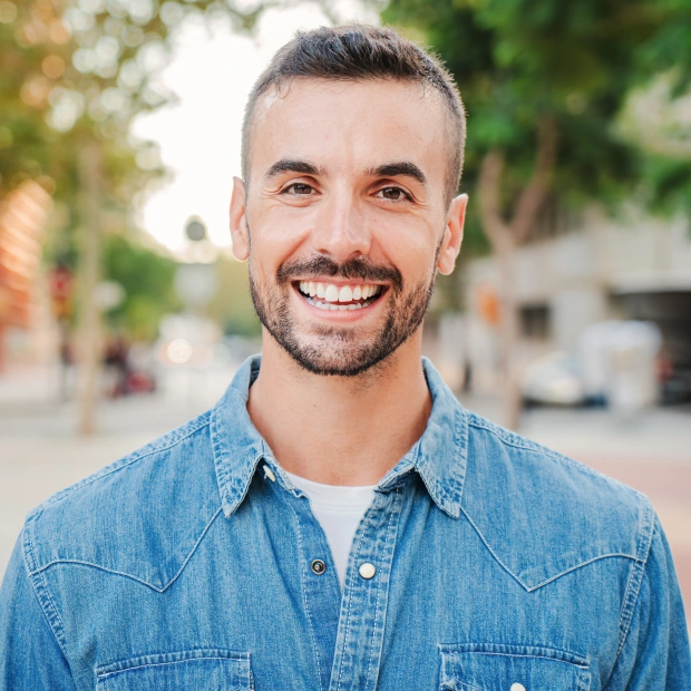 Patient smiling after restorative dental treatment