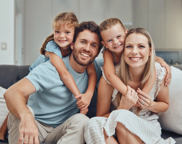 Family smiling together after a dental visit
