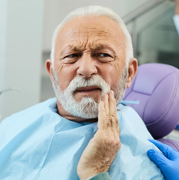 Patient receiving compassionate tooth extraction care